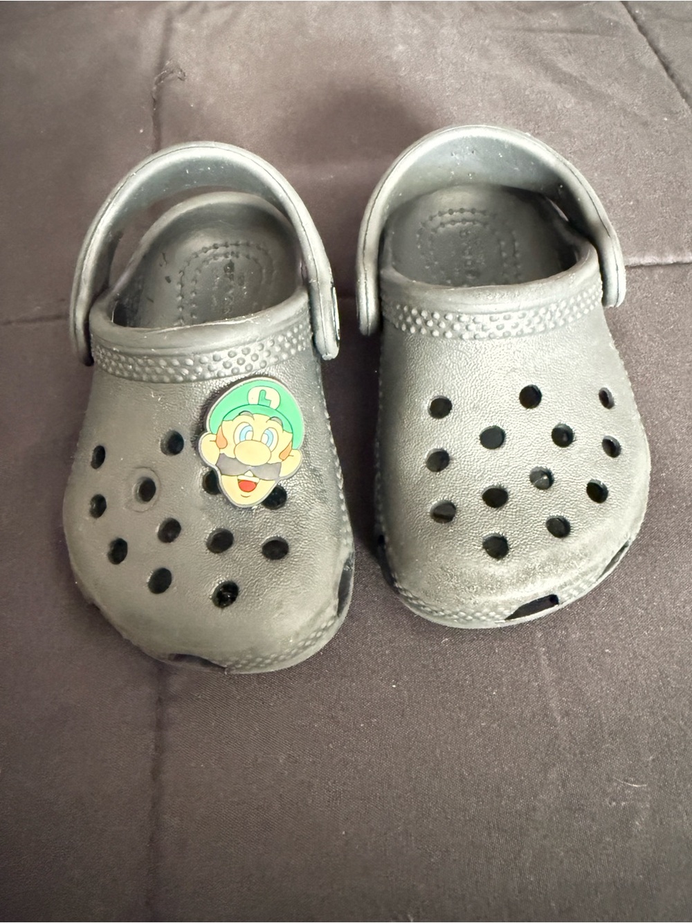 CROCS Kids Black Slip-On Clogs with Green Character Charm